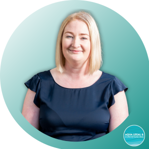 Ali Fitzner, lawyer at Aqua Legal, confidently smiling in a professional setting.