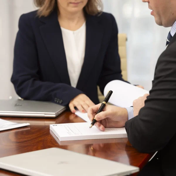 document-with-two-people-min.jpg Two people reviewing legal documents together during a family law consultation in Australia